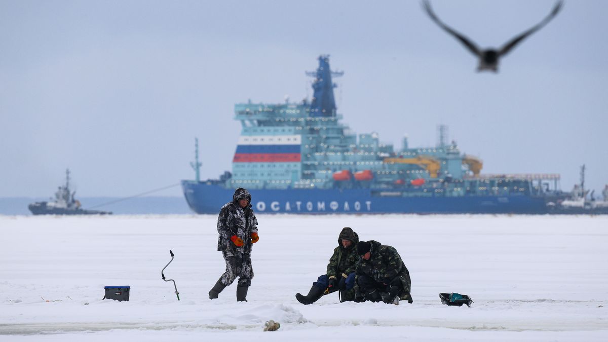ST  PETERSBURG, RUSSIA - 2025/02/03: Fishermen fish on the ice of the Gulf of Finland with the nuclear icebreaker Yakutia, seen in the background as it entered the Gulf of Finland for sea trials in St. Petersburg. The nuclear icebreaker Yakutia, part of Project 22220, departed from the Galerny Fairway to the Gulf of Finland for testing. Specialists will assess its main systems and equipment, including communications, navigation, anchor and steering gear, and helicopter operations. Built by USC Baltic Shipyard and commissioned by Rosatom on May 26, 2020, Yakutia is designed to ensure shipping in the Arctic and support the development of the Northern Sea Route. With the capability to break through ice up to three meters thick, it plays a critical role in Russia's Arctic strategy. Meanwhile, U.S. President Donald Trump has ordered the development of an icebreaker fleet to safeguard U.S. interests in the Arctic and Antarctic and strengthen the nation's presence in these regions. (Photo by Artem Priakhin/SOPA Images/LightRocket via Getty Images)