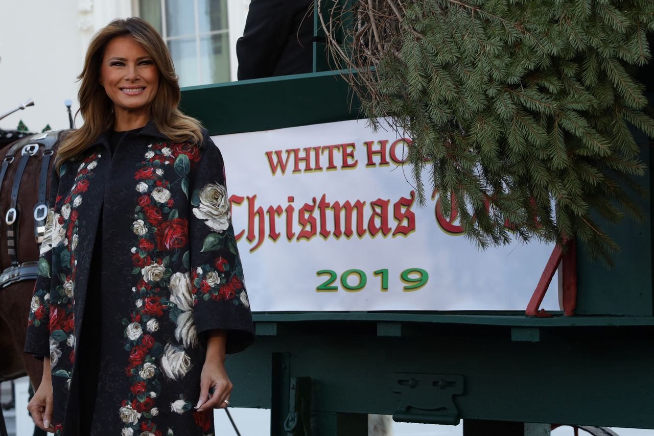 WASHINGTON, DC - NOVEMBER 25:  U.S. first lady Melania Trump receives the 2019 White House Christmas Tree from Mahantongo Valley Farms in Pennsylvania at the North Portico of the White House November 25, 2019 in Washington, DC. Following a tradition started in 1966, a winning tree in a National Christmas Tree Association contest gets the honor of being presented to the first family as the White House Christmas Tree, to be decorated and placed in the Blue Room for the holiday season.  (Photo by Alex Wong/Getty Images)