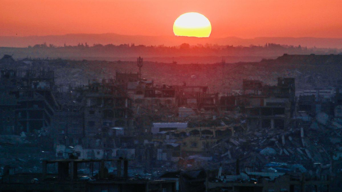 TemporaryThe sun rises over a heavily damaged area of Jabalia, in the northern Gaza Strip on December 24, 2025. (Photo by Bashar Taleb / AFP)BASHAR TALEB