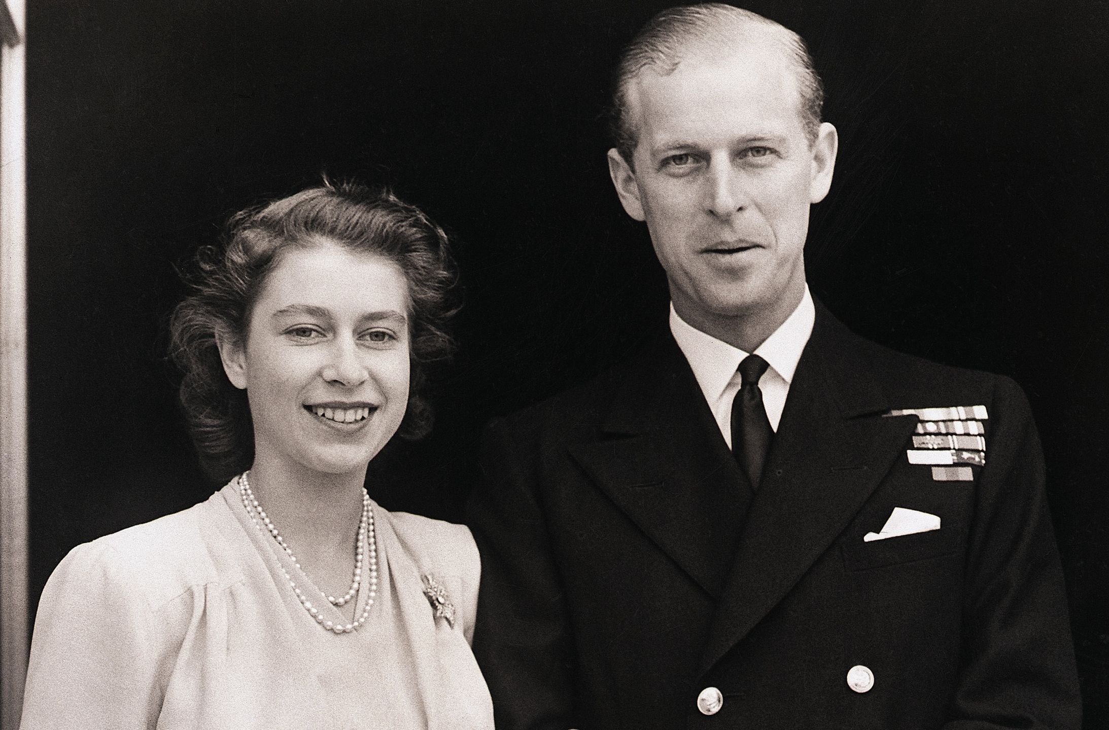 Princess Elizabeth and Philip Mountbatten(Original Caption) 7/11/1947-London, England- Princess Elizabeth, Britain's future queen, and Lt. Philip Mountbatten shown at Buckingham Palace. On her engagement finger, the Princess wears a three-diamond ring, symbolic of her bethrotal. Photo was made July 10th when the royal lovers made their first public appearance following announcement of their engagement by King George.Bettmanntwo people:CB3, queen:CB1, engagement ring:CB1, body image:CB1, couples:CB1, Buckingham Palace:CB1, Queen Elizabeth II:CB1, Prince Philip Duke of Edinburgh:CB1, first:CB1, duke:CB1