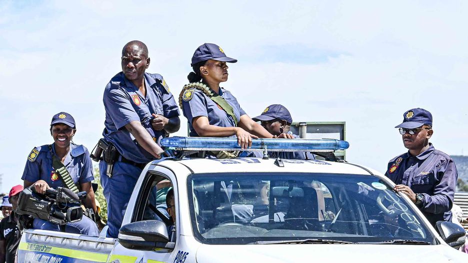 BLOEMFONTEIN, SOUTH AFRICA ? MARCH 05: The police monitor the situation during a Lourierpark residents protest against illegal land occupiers on March 05, 2024 in Bloemfontein, South Africa. This comes after about 1500 illegal land occupiers flocked to the area. The Democratic Alliance (DA) has approached the High Court In Bloemfontein for an urgent  court order to remove the occupiers. (Photo by Mlungisi Louw/Volksblad/Gallo Images via Getty Images)