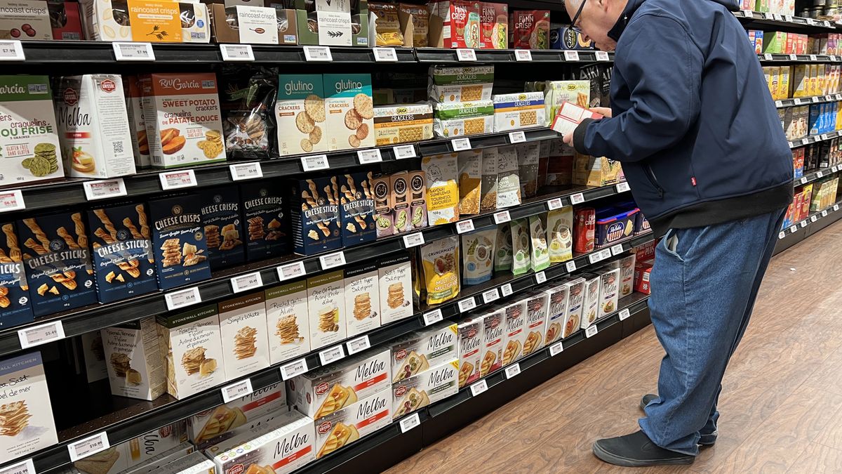 A man is shopping for food at a grocery store in Toronto, Ontario, Canada, on December 9, 2023. A new survey by the Salvation Army indicates that one in four Canadians is extremely concerned about not having enough income to cover their basic needs because of the cost of living crisis and rising food prices affecting Canadians. (Photo by Creative Touch Imaging Ltd./NurPhoto via Getty Images)