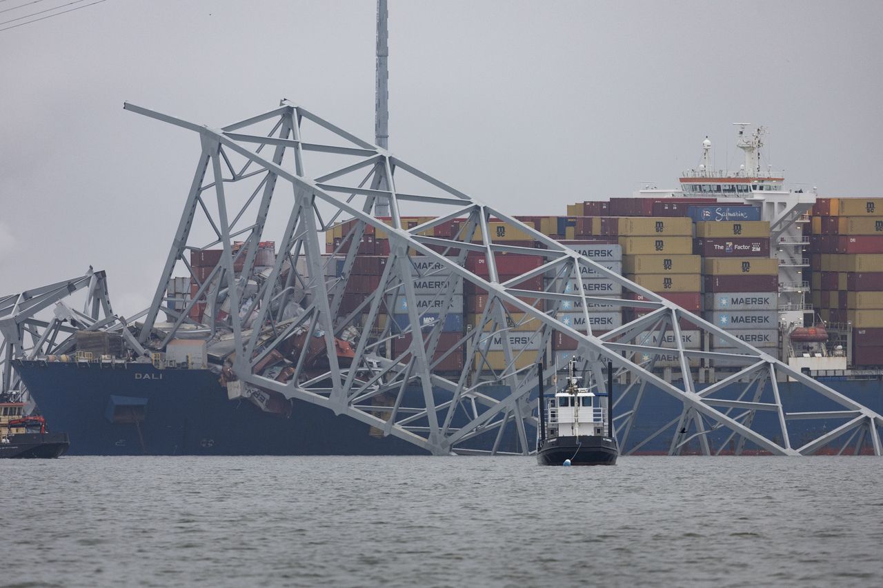 BALTIMORE, MARYLAND - MARCH 27: Workers continue to investigate and search for victims after the cargo ship Dali collided with the Francis Scott Key Bridge causing it to collapse yesterday, on March 27, 2024 in Baltimore, Maryland. Two survivors were pulled from the Patapsco River and six missing people are presumed dead after the Coast Guard called off rescue efforts. A work crew was fixing potholes on the bridge, which is used by roughly 30,000 people each day, when the ship struck at around 1:30am on Tuesday morning. The accident has temporarily closed the Port of Baltimore, one of the largest and busiest on the East Coast of the U.S. (Photo by Scott Olson/Getty Images)