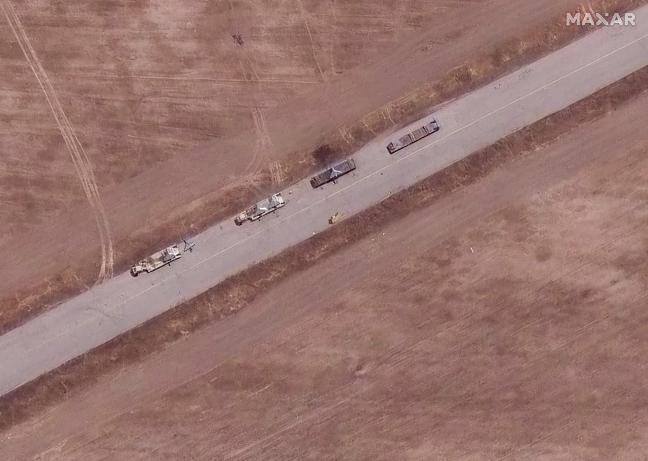 DEZFUL, IRAN -- JUNE 17, 2025: 12  Maxar Satellite Imagery shows Shahed-136 drones positioned on trailers and laid out on tarmac areas at Dezful Airbase. Location: 32.440, 48.388. Please use: Satellite image (c) 2025 Maxar Technologies.