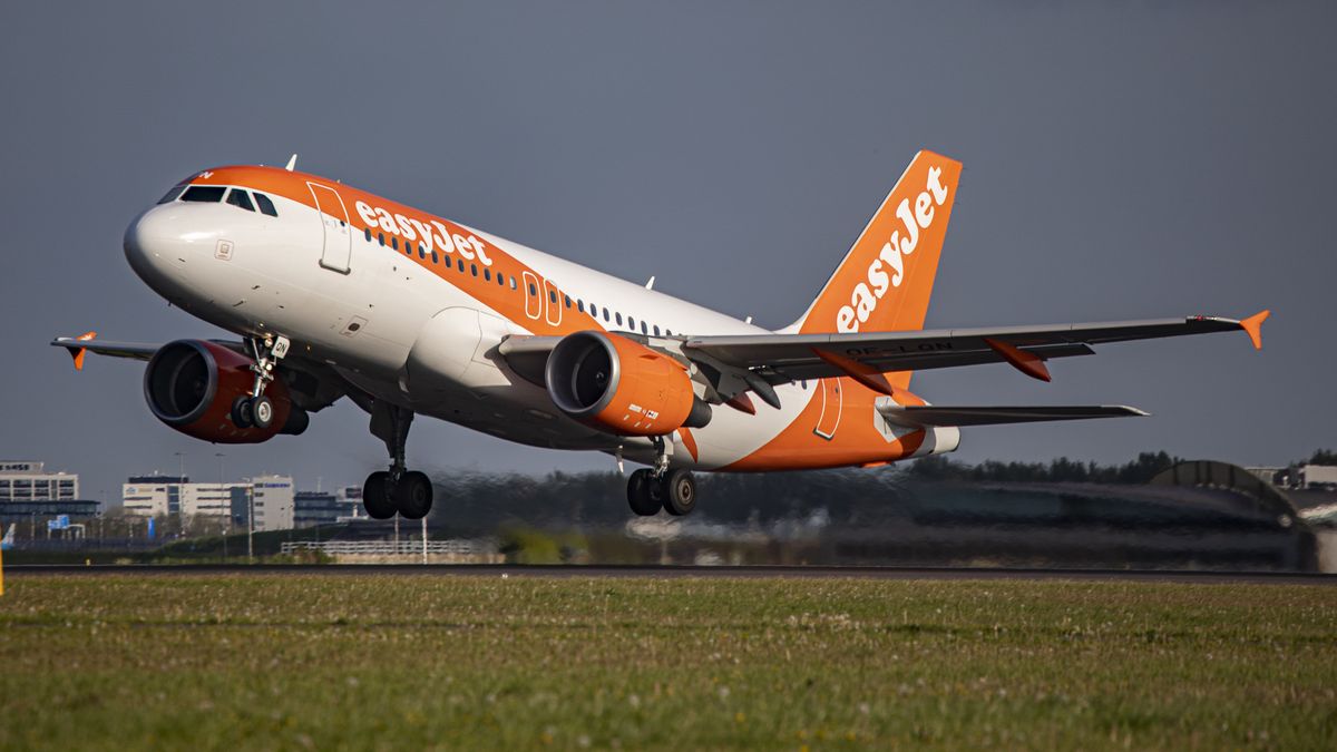 EasyJet Europe Airbus A319 aircraft as seen during taxiing, rotate and take off phase flying as departs from Amsterdam Schiphol Airport. The A319 has the registration OE-LQN. EasyJet is a British multinational low cost airline group with headquarters at London Luton Airport while EasyJet Europe Airline GmbH is based in Vienna Austria with a fleet of 127 airplane. The aviation industry is showing recovery and increased demand after the Covid-19 Coronavirus pandemic measures have been easing across the worlds. Amsterdam, Netherlands on April 27, 2022 (Photo by Nicolas Economou/NurPhoto via Getty Images)