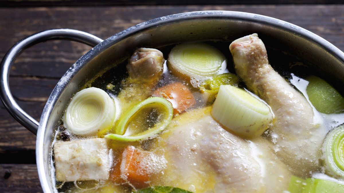 Cooking pot with raw corn-fed chicken, onion, herbs and greens , close-up
Westend61
Dishes, Cooking Pot, no people, food and drink, meat, Poultry, chicken, water, close up, Vegetable, Celeriac, Carrot, Leek, indoor, studio shot, elevated view, overhead view, raw, wood, wooden, uncooked, bay leaf, sliced, spice, herbs, culinary herb, parsley, frizzy parsley, bouquet garni pour boullion, corn-fed chicken, Part Of, Chicken Soup, boiling fowl, greens, dark wood
