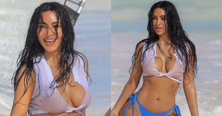 Mokra Kim Kardashian w bikini wdzięczy się do aparatu podczas sesji zdjęciowej na plaży