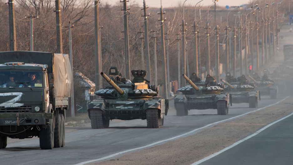 A column of tanks marked with the Z symbol stretches intoMARIUPOL, UKRAINE - 2022/03/23: A column of tanks marked with the Z symbol stretches into the distance as they proceed northwards along the Mariupol-Donetsk highway. The battle between Russian / Pro Russian forces and the defencing Ukrainian forces lead by Azov battalion continues in the port city of Mariupol. (Photo by Maximilian Clarke/SOPA Images/LightRocket via Getty Images)SOPA Imagestank, z symbol, z