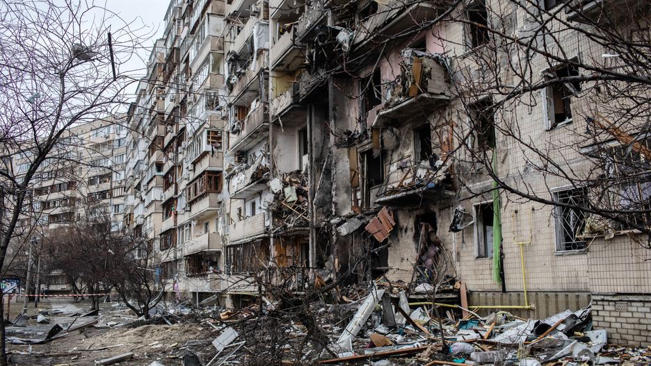 A fire damaged building following a blast at around 4am during Russian artillery strikes in Kyiv, Ukraine, on Friday, Feb. 25, 2022. Ukraines president said Moscow-led forces were continuing attacks on military and civilian targets on the second day of their invasion after the U.S. and its allies imposed new sanctions on Moscow and U.S. President Joe Biden warned of "a dangerous moment for all of Europe." Photographer: Erin Trieb/Bloomberg via Getty Images