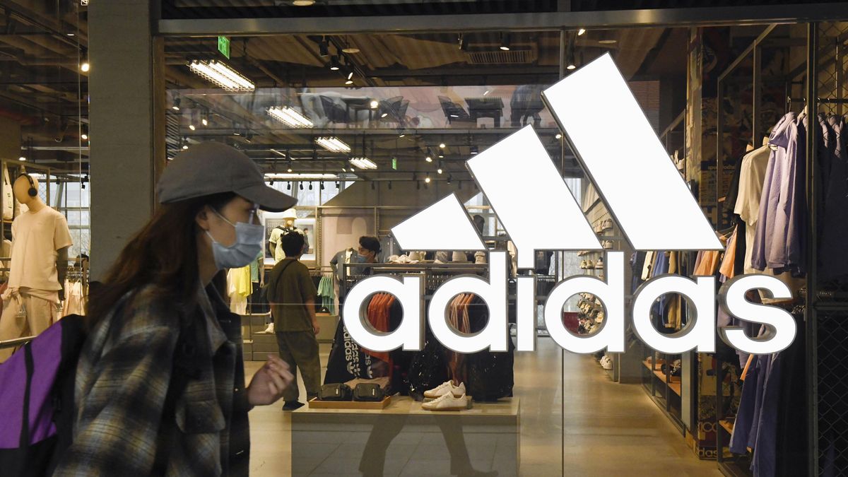 File photo taken March 26, 2021, shows an Adidas store in Beijing. (Photo by Kyodo News via Getty Images)