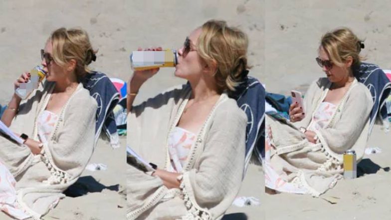 Anna Kalczyńska pije piwo na plaży i fotografuje pociechy