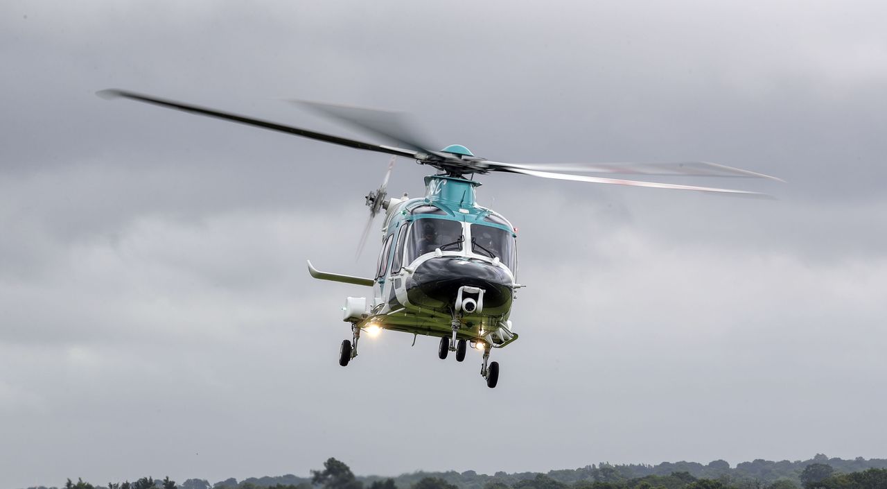 An Air Ambulance helicopter flies in as Joe Pelham, 14, meets the team from the Air Ambulance Kent Sussex Surrey who saved his life after he was hit by a car whilst cycling. (Photo by Steve Parsons/PA Images via Getty Images)