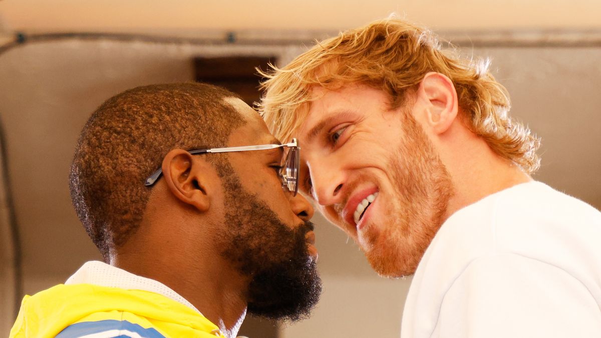 MIAMI BEACH, FLORIDA - JUNE 03: Floyd Mayweather (L) and Logan Paul face off during media availability ahead of their June 6th exhibition boxing match on June 03, 2021 at Villa Casa Casuarina at the former Versace Mansion in Miami Beach, Florida. (Photo by Cliff Hawkins/Getty Images)