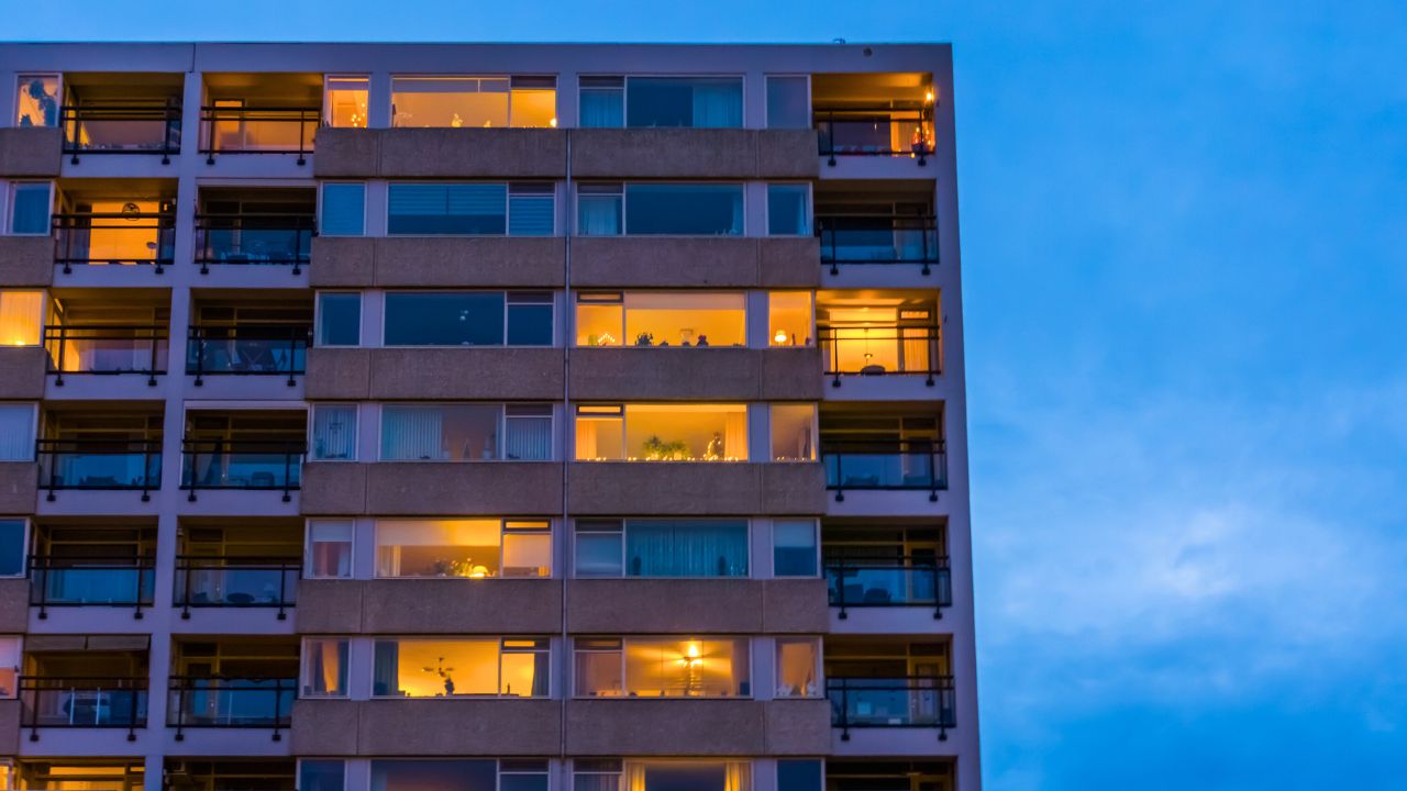 Lights on in the flats of the block