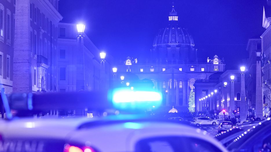 ROME, ITALY - DECEMBER 29: A night view of St. Peter's Basilica with the lights of a local police vehicle in Vatican City on December 29, 2022 in Rome, Italy. (Photo by Emmanuele Ciancaglini/Ciancaphoto Studio/Getty Images)