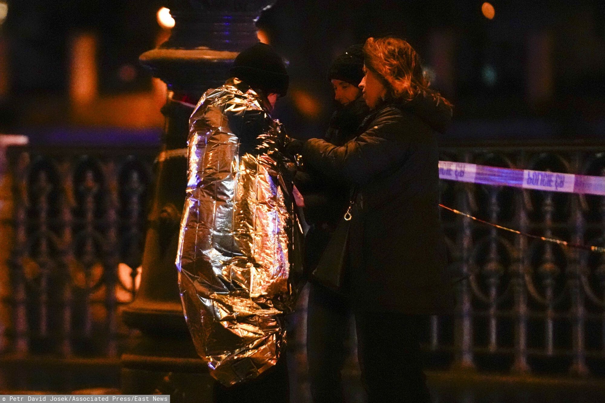 Temporary
Women attend to a person wrapped in a thermal blanket near the building of Philosophical Faculty of Charles University in downtown Prague, Czech Republic, Thursday, Dec. 21, 2023. A mass shooting in downtown Prague killed several people and injured others, and the person who opened fire also is dead, Czech police and the city's rescue service said Thursday. (AP Photo/Petr David Josek)
Petr David Josek