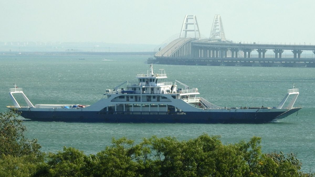 Temporary
A ferry crosses the Kerch strait from Port Caucasus (Kavkaz), Krasnodar region in southern Russia, towards Port Crimea near Kerch, on October 10, 2022, with the Kerch bridge in the background, which was hit by a blast on October 8, 2022. (Photo by AFP)
-