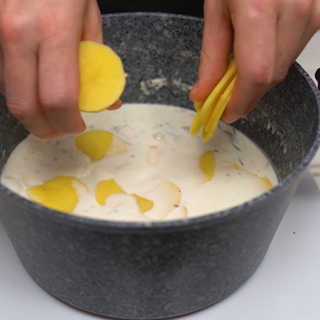 I throw potatoes into the pot with a creamy mixture.