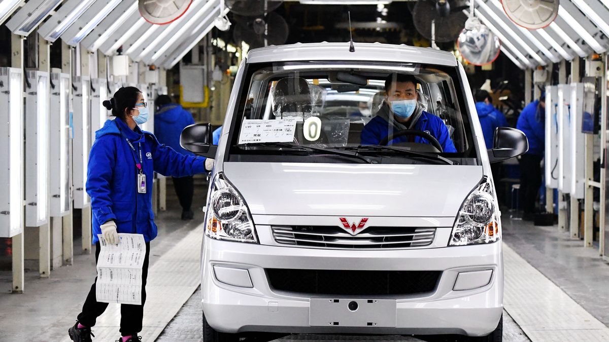 QINGDAO, CHINA - JANUARY 31, 2023 - Workers at a workshop check a car that is about to roll off the assembly line at SAIC General Motors Wuling branch in Qingdao, east China's Shandong province, Jan 30, 2023. According to the National Bureau of Statistics, China's manufacturing purchasing managers' Index (PMI) for January 2023 was 50.1 percent, up 3.1 percentage points from the previous month, which indicates that the economy of China's manufacturing sector has recovered significantly. (Photo credit should read CFOTO/Future Publishing via Getty Images)
