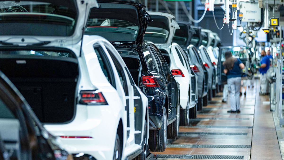 Workers fit car doors to VW Golfs on the assembly line at the Volkswagen AG factory in Wolfsburg, Germany, on Thursday, May 23, 2024. Auto sales in Europe rose 12% in April as manufacturers including Volkswagen AG and Renault SA benefited from robust demand for plug-in and conventional cars in several major markets. Photographer: Krisztian Bocsi/Bloomberg via Getty Images
