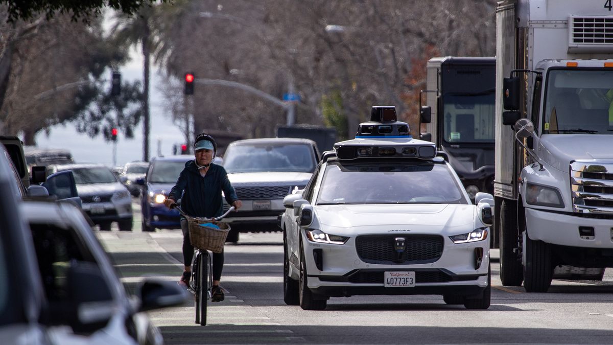 Santa Monica, CA - February 21: Passengers ride in an electric Jaguar I-Pace car outfitted with Waymo full self-driving technology in Santa Monica Tuesday, Feb. 21, 2023.  (Allen J. Schaben / Los Angeles Times via Getty Images)
