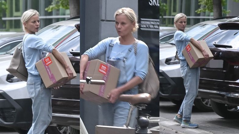 Naturalna Małgorzata Foremniak taszczy karton do swojej fury