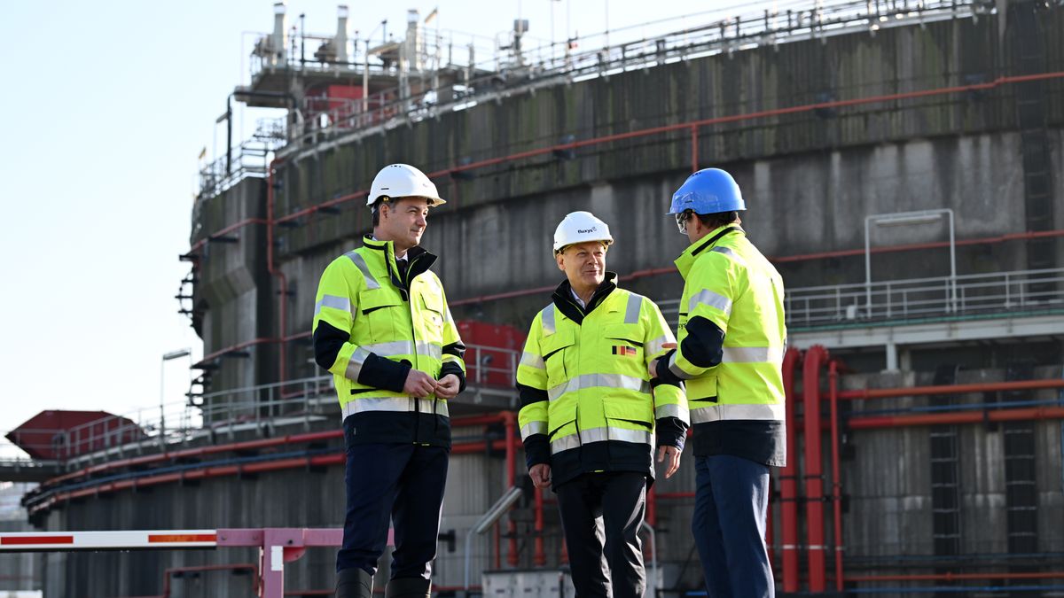 Alexander De Croo, Belgium's prime minister, left, Olaf Scholz, Germany's chancellor, center, and Pascal De Buck, chief executive officer of Fluxys SA, visit the Fluxys liquid natural gas (LNG) terminal, on the sidelines of the Belgian-German Energy Summit, at the port of Zeebrugge, Belgium, on Tuesday, Feb. 14, 2023. Scholz met Decroo amid reports of a plan for a second interconnector to increase cross-border electricity flows between Germany and Belgium. Photographer: Dirk Waem/Belga/Bloomberg via Getty Images