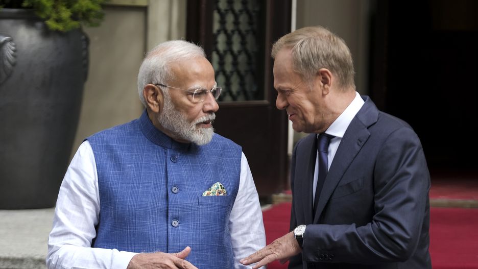 Narendra Modi, India's prime minister, left, and Donald Tusk, Poland's prime minister, at an honour guard review in Warsaw, Poland, on Thursday, Aug. 22, 2024. Modi, who is scheduled to visit Ukraine on Friday, said he supports peace in the region and reiterated a call for diplomacy to end conflict. Photographer: Damian Lemanski/Bloomberg via Getty Images