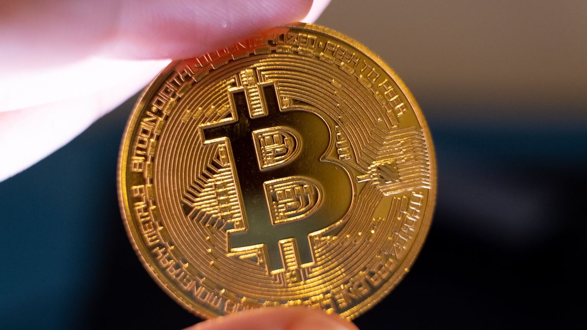 A macro shot of a man's hand holding a Bitcoin representation is seen in Athens, Greece, on September 4, 2025. (Photo by Nikolas Kokovlis/NurPhoto via Getty Images)