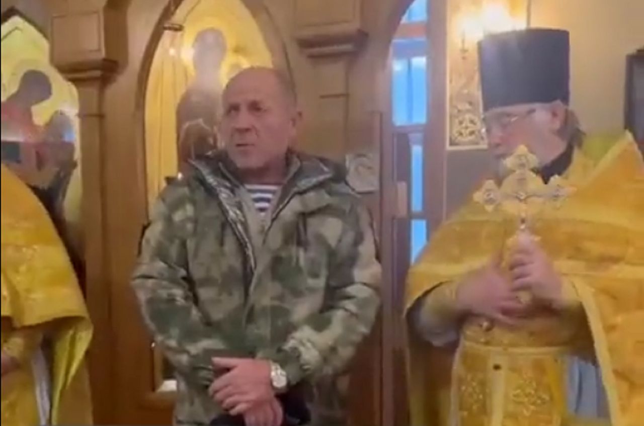 The Russian soldier went to the Church. He is asking for money.