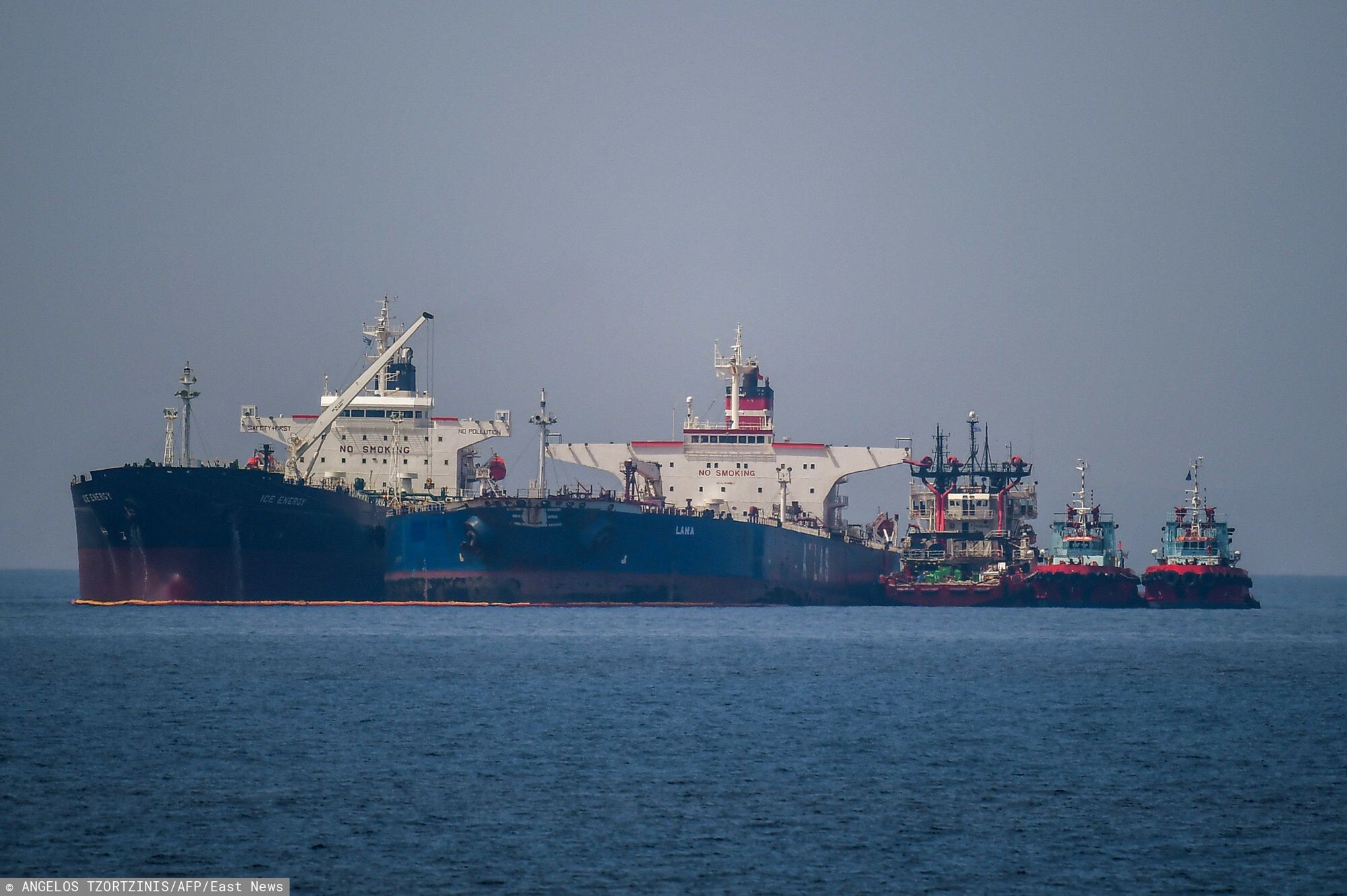 Temporary
The Liberian-flagged oil tanker Ice Energy (L) transfers crude oil from the Iranian-flagged oil tanker Lana (R) (former Pegas), off the shore of Karystos, on the Island of Evia, on May 29, 2022. - Greece will send Iranian oil from a seized Russian-flagged tanker to the United States at the request of the US judiciary, Greek port police said Wednesday, a decision that angered Tehran. Last month the Greek authorities seized the Pegas, which was said to have been heading to the Marmara terminal in Turkey. The authorities seized the ship in accordance with EU sanctions introduced after Russia invaded Ukraine in February. (Photo by Angelos Tzortzinis / AFP)
ANGELOS TZORTZINIS