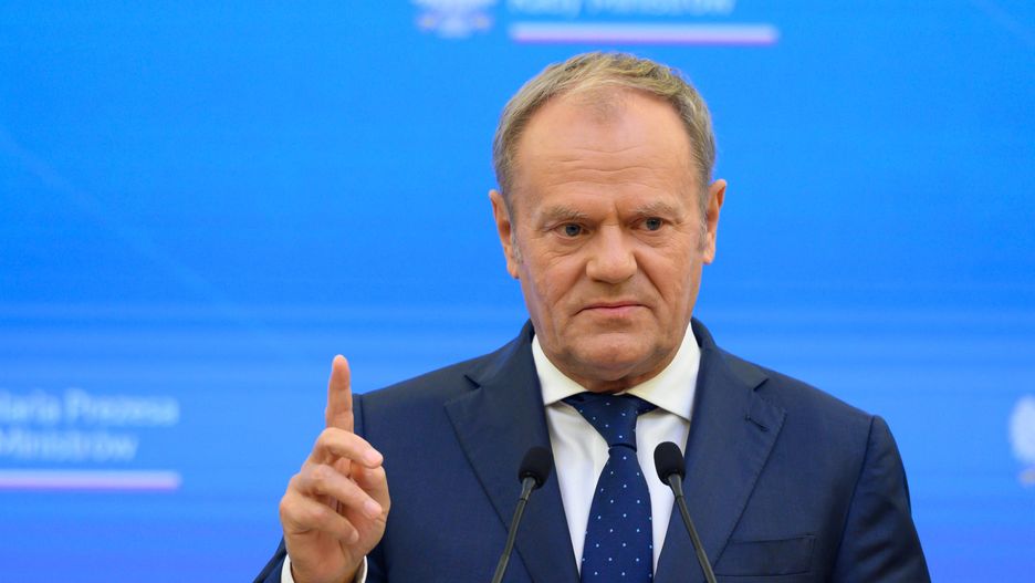 Polish Prime Minister Donald Tusk gestures as he takes part in a press briefing with Lithuania's Prime Minister Inga Ruginiene in Warsaw, Poland, on October 7, 2025. The main topics of the bilateral meeting are defense and security cooperation on the NATO eastern flank amid the ongoing Russian full-scale aggression on Ukraine, further support for Ukraine, and migration policy. (Photo by Aleksander Kalka/NurPhoto via Getty Images)