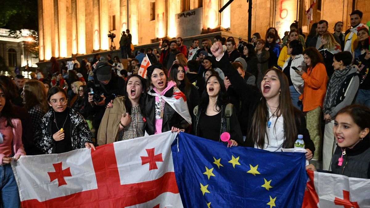 Temporary
Protestors chant as they demonstrate against the "foreign influence" law, outside the Georgian Parliament in Tbilisi, on May 18, 2024. Georgian President Salome Zurabishvili on May 18, 2024 put a mostly symbolic veto on the "foreign influence" law that sparked unprecedented protests and warnings from Brussels that the measure would undermine Tbilisi's EU aspirations.Ruling Georgian Dream party lawmakers voted through the legislation on May 14, 2024 in defiance of protesters concerned the ex-Soviet republic is shifting away from a pro-Western course back toward Russia, sparking a wave of protests unprecedented in the recent history of the Black Sea nation.



Weeks-long mass protests continue against the "foreign influence" law after Georgian Dream party lawmakers voted through the legislation on May 14, 2024 in defiance of protesters worried the Caucasus country is shifting away from a pro-Western course towards Russia. (Photo by Vano SHLAMOV / AFP)
VANO SHLAMOV
