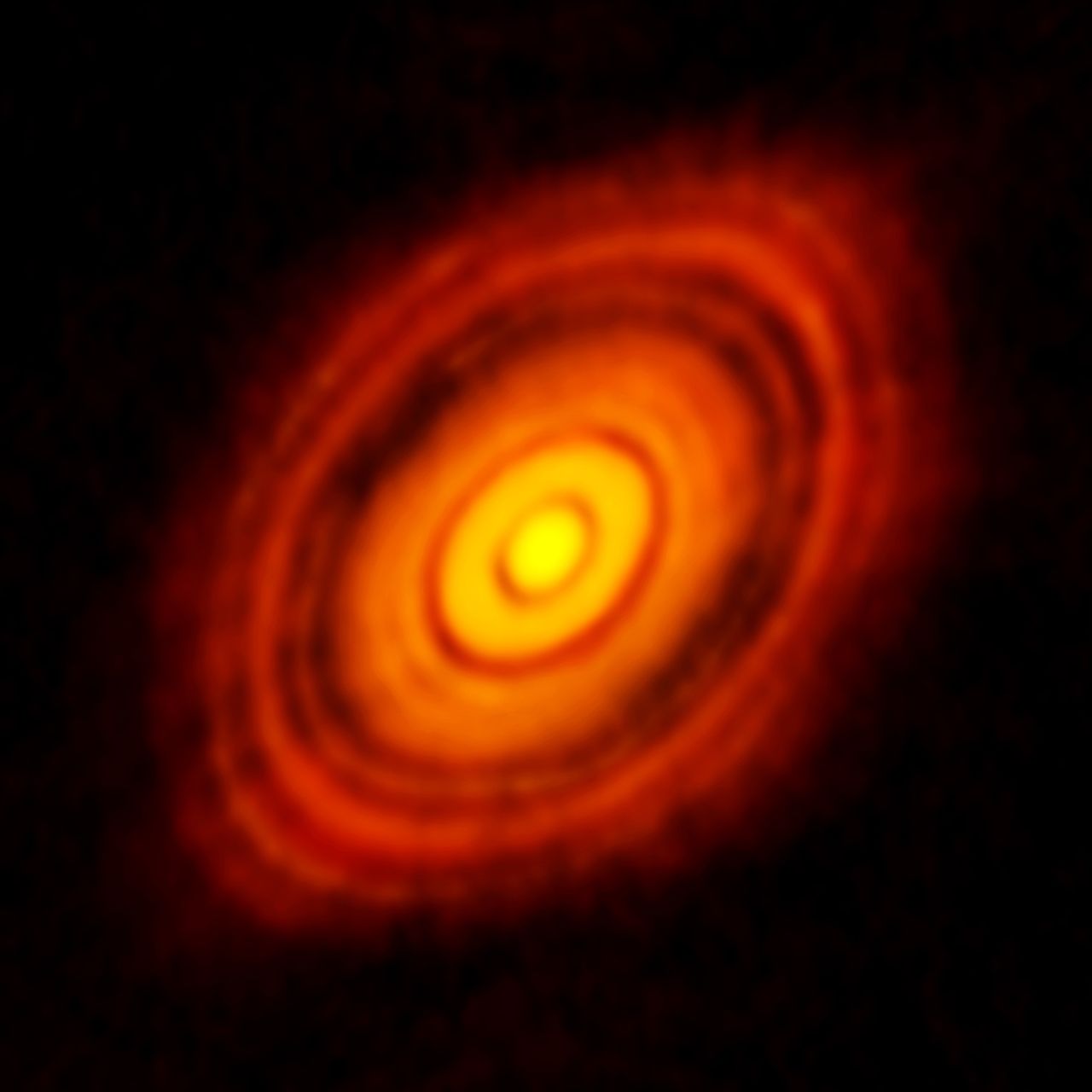 Obraz radiowy młodej gwiazdy HL Tauri i dysku protoplanetarnego
