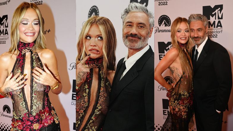 MTV EMA 2022. Rita Ora pozuje w koronkowej sukience z dekoltem do pępka u boku starszego o 15 lat męża 