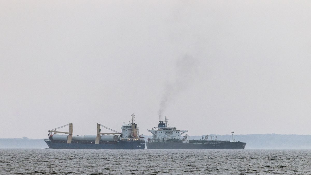 The shadow fleet tanker Turbo Voyager, right, passes within 600 meters of a general cargo vessel as it transits through the Great Belt of Denmark off the coast of Agerso, Denmark, on Thursday, Aug. 15. 2024. On the small Danish island of Agerso, fisherman and beach-goers see old tankers carry Russian oil through Denmark's narrow straits on a daily basis. Photographer: Carsten Snejbjerg/Bloomberg via Getty Images