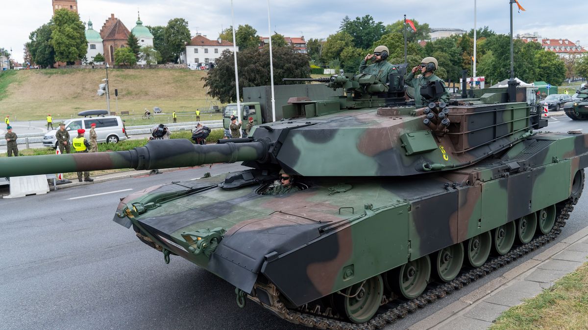 WARSAW, POLAND - 2024/08/11: M1A1 FEP Abrams passes by during the general rehearsal. Poland Armed Forces and other allied forces participate in the rehearsal for the upcoming military parade on National Army Day on August 15. This event will feature over 2,500 soldiers from the Polish Armed Forces and nearly 100 allied soldiers from the U.S., U.K., and Romania. The parade will showcase modern military equipment, including the K2 Black Panther tank, Krab howitzer, Rosomak APC, Himars missile launcher, Patriot air defense system, and Black Hawk helicopter. The event will also include air shows with various aircraft. (Photo by Marek Antoni Iwanczuk/SOPA Images/LightRocket via Getty Images)