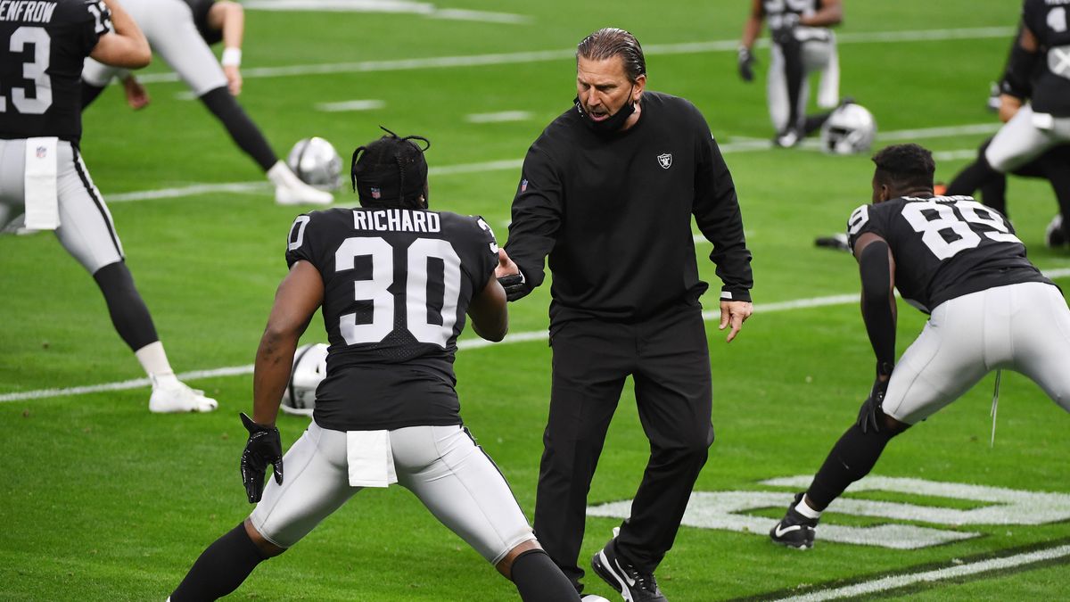 LAS VEGAS, NEVADA - DECEMBER 13: Las Vegas Raiders running back Jalen Richard #30 is greeted by offensive coordinator Greg Olson during warmups against the Indianapolis Colts at Allegiant Stadium on December 13, 2020 in Las Vegas, Nevada. (Photo by Ethan Miller/Getty Images)