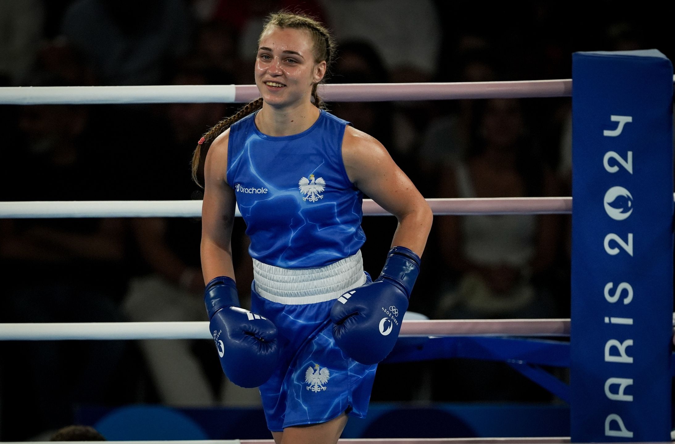 PARIS, FRANCE - AUGUST 7: Julia Szeremeta (blue) of Team Poland competes against Nesthy (red) of Team Philippines compete in the women's 57kg semi-final boxing match during the Paris 2024 Olympic Games on the twelfth day at the Roland-Garros Stadium, in Paris, France on August 7, 2024. (Photo by Mustafa Ciftci/Anadolu via Getty Images)
