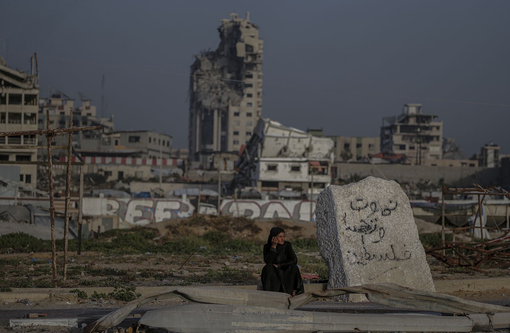 Internally displaced Palestinians
epa12092684 An internally displaced Palestinian woman sits next destroyed nuildings in Gaza City on, 11 May 2025. More than 51,000 Palestinians have been killed in the Gaza Strip, according to the Palestinian Ministry of Health, since Israel launched a military campaign in the strip in response to a cross-border attack led by the Palestinian militant group Hamas on 07 October 2023, in which about 1,200 Israelis were killed and more than 250 taken hostage.  EPA/MOHAMMED SABER 
Dostawca: PAP/EPA.
MOHAMMED SABER
Gaza
