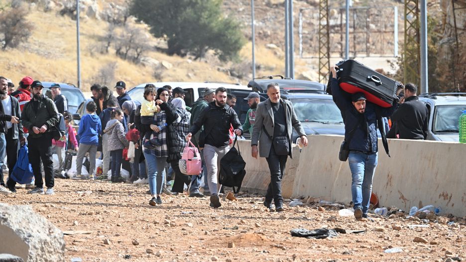 MASSNA, LEBANON - NOV 9: A view of Masnaa Border Crossing as Lebanese trying to enter Syria by crossing the main road on foot in Massna, Lebanon on November 9, 2024. Israel launched an airstrike on the Lebanese side of the Masnaa border crossing between Lebanon and Syria. Lebanese people who want to migrate to Homs, Aleppo, Damascus and Hama provinces evacuated by the Assad regime in Syria, are trying to enter Syria by crossing the main road on foot after the Israeli army attacks on different parts of Lebanon. (Photo by Houssam Shbaro/Anadolu via Getty Images)