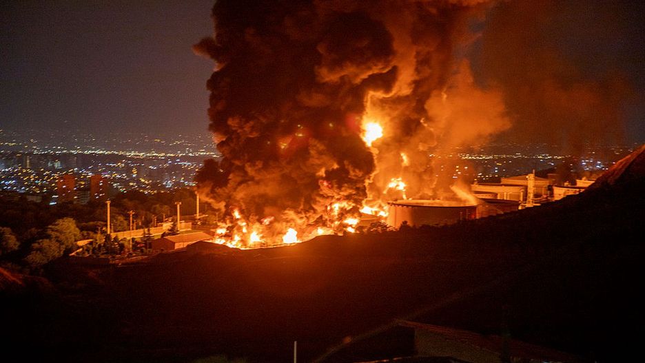 Iran Calls Israeli Strikes 'Declaration Of War' As Region Braces For Escalation
TEHRAN, IRAN - JUNE 15: Fire and smoke rise into the sky after an Israeli attack on the Shahran oil depot on June 15, 2025 in Tehran, Iran. Iran's foreign minister said the country would respond decisively and proportionally to a wave of attacks that Israel launched beginning in the early hours of June 13. The attacks targeted multiple military, scientific and residential locations, as well as senior government officials. (Photo by Stringer/Getty Images)
Getty Images