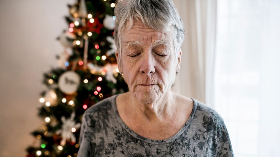A Close-up of sad senior woman's face on the christmas dayClose-up of sad senior woman's face with wrinkles and glassessad, depress, older, senior, christmas, holiday, woman, person, face, social, depression, old, mothers day, mourning, new year, new years eve, nursing, parkinson, problem, portrait, migraine, retirement, sick, xmas, pensioner, memory, alone, lonely woman, alzheimer, melancholy, christmas atmosphere, close up, dark, dizziness, drug, elderly, elderly woman, dementia, grandmother, home, insomnia, issue, lonely person, lonely, glasses, disabled, illness, wrinkles, sadness
