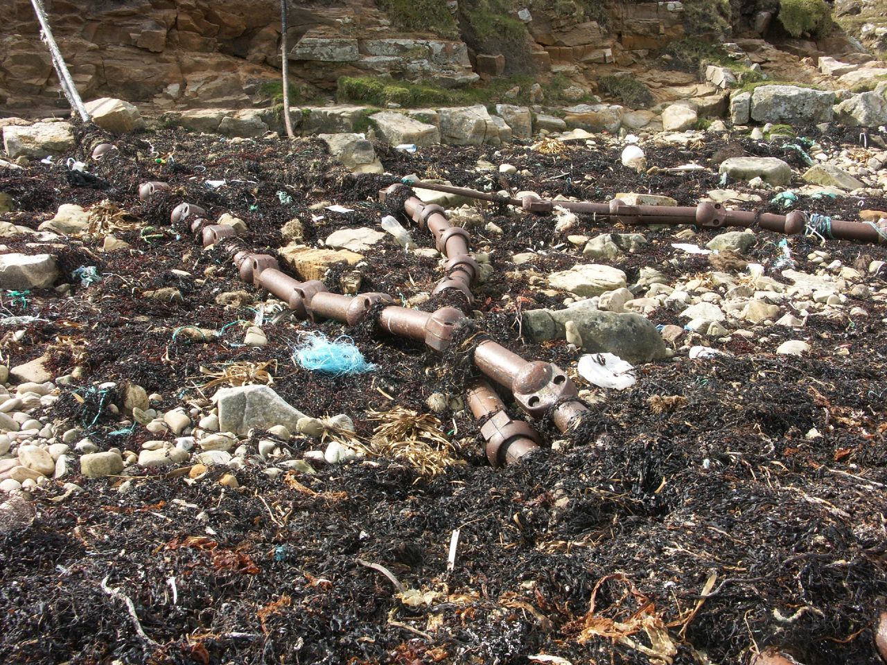 Underwater telecommunication cables exposed on the Orkney coast