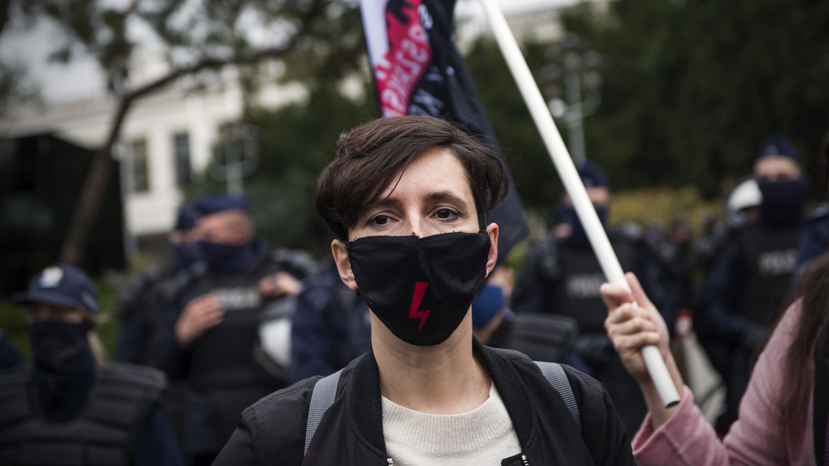 Klementyna Suchanow, an activist, writer and the leader ofWARSAW, POLAND - 2020/10/28: Klementyna Suchanow, an activist, writer and the leader of the Women's Strike wearing a face mask takes part during the demonstration.Crowds have protested in several cities for the seventh-day running against the decision that outlawed terminations on the grounds of severe health defects. In Warsaw thousands of people came to protest outside the parliament, protesters chanted "this is war what became the motto of Women's Protest across the country. (Photo by Attila Husejnow/SOPA Images/LightRocket via Getty Images)SOPA Imageshealth defects, abortion bill, unconstitutional, ruling law, demo, demonstration, rally, demonstrator, protester, demonstrators, protesters, klementyna suchanow, facemask, face mask, protective mask, mask, masks, facial mask