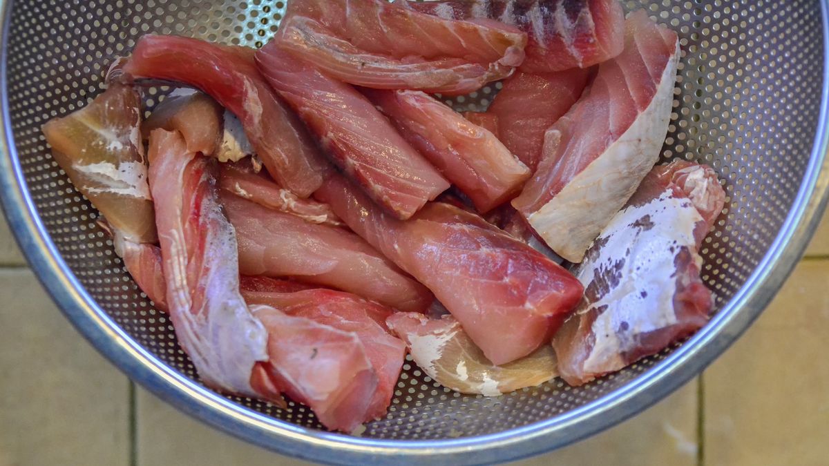 Raw fish clean cut into pieces / slices in a metal bowl / container and being seasoned with salt before cooking
Raw fish clean cut into pieces / slices in a metal bowl / container and being seasoned with salt before cooking
Madiha Ali