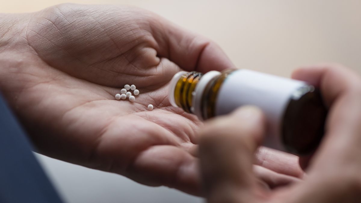 Homeopathic pills (globules)
A woman is pouring homeopathic pills (globules) from a glass flask into the palm of her hand
EThamPhoto
globule, globules, globuli