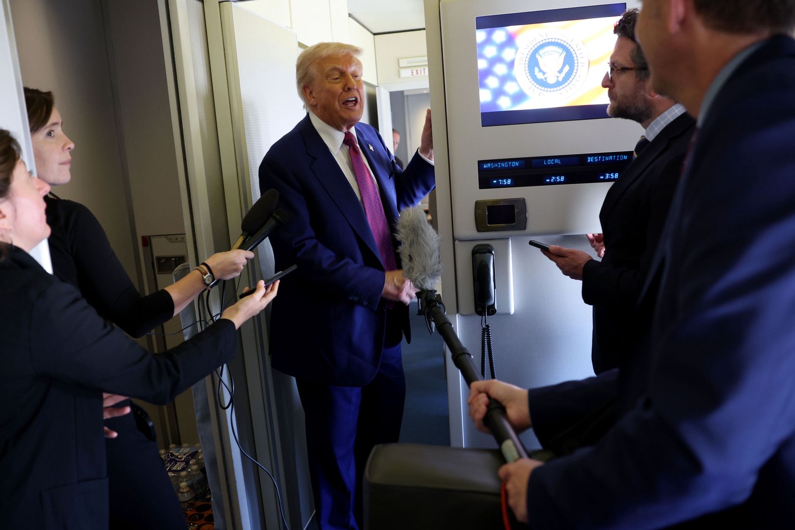 DOHA, QATAR - MAY 15:  U.S. President Donald J. Trump speaks to journalists as he departs the Al Udeid Air Base for Abu Dhabi on May 15, 2025, in Doha, Qatar. Trump is on the third day of his visit to the Gulf to underscore the strategic partnership between the United States and Qatar, focusing on regional security and economic collaboration and will visit Abu Dhabi, United Arab Emirates next.   (Photo by Win McNamee/Getty Images)