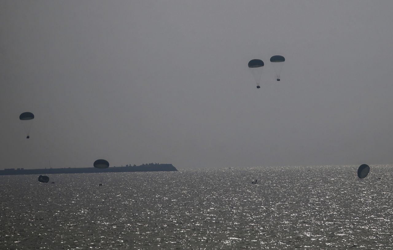 26th of February. A Jordanian plane drops humanitarian aid into the sea off the coast of the southern Gaza Strip.