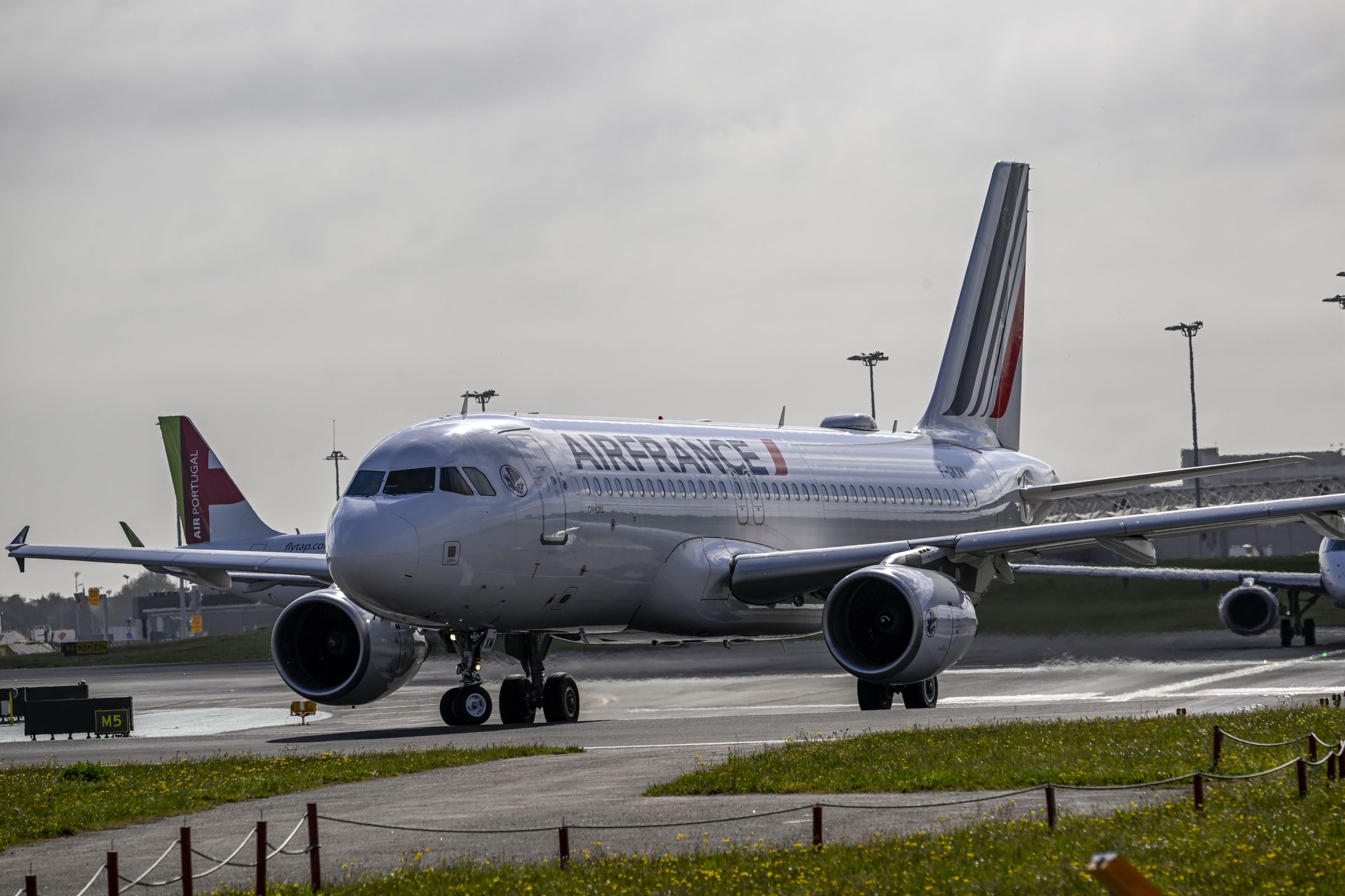 LISBON, PORTUGAL - APRIL 01: An Air France aircraft taxies to take off on a busy day in Humberto Delgado International Airport on April 01, 2023, in Lisbon, Portugal. According to the Portuguese National Institute of Statistics (INE), foreign tourists stood out in the overnight stays, totaling 2.7 million in the second month of 2023, up 51 percent year-on-year. The domestic market contributed, in turn, with 1.4 million overnight stays, an increase of 19 percent compared to February 2022. Hotel stays continued to grow in February compared to the same month last year, with 1.7 million guests (a 33 percent increase) and four million overnight stays (a 38.5 percent increase). (Photo by Horacio Villalobos#Corbis/Corbis via Getty Images)